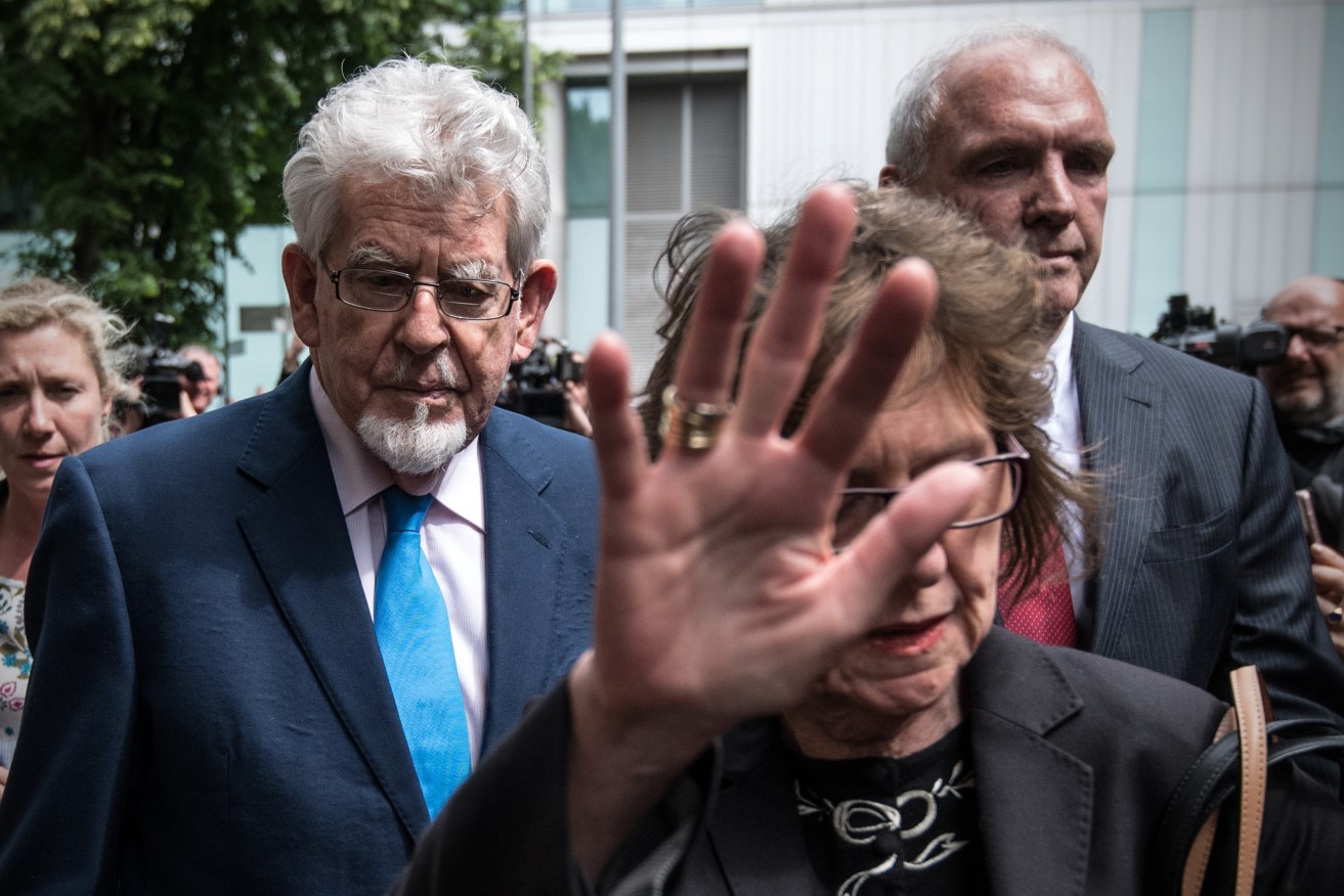 Harris leaves a London court, surrounded by family and supporters, in 2017.