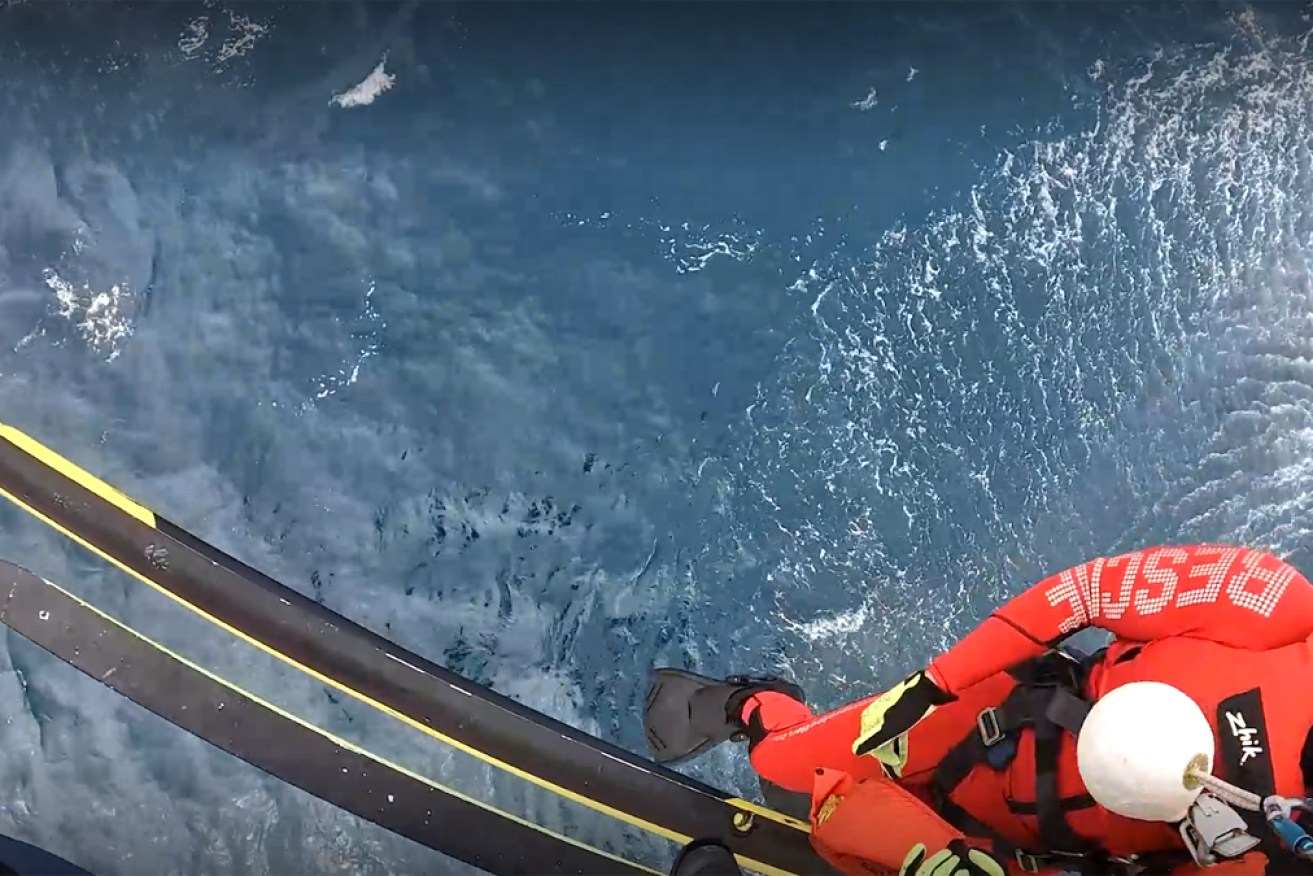 The two men were spotted by crew aboard a Queensland Ambulance Services helicopter.