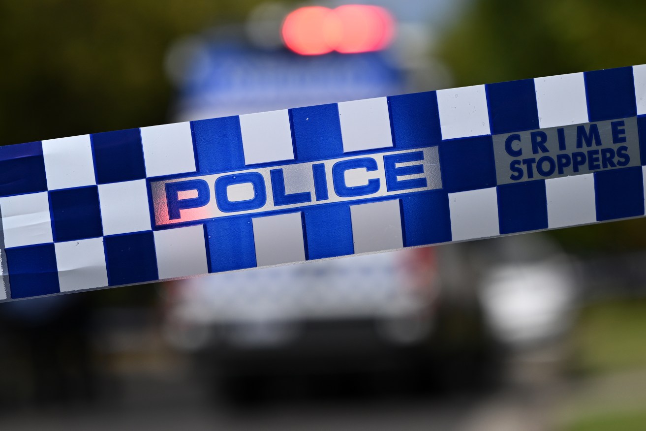 Two men are facing charges after a man's body was found in a cabinet in a creek near Coffs Harbour.