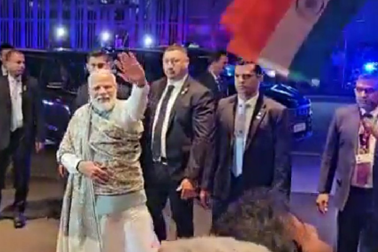Indian Prime Minister Narendra Modi is welcomed at Sydney Airport. 