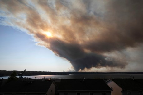 Thousands evacuate as wildfires rage in Canada