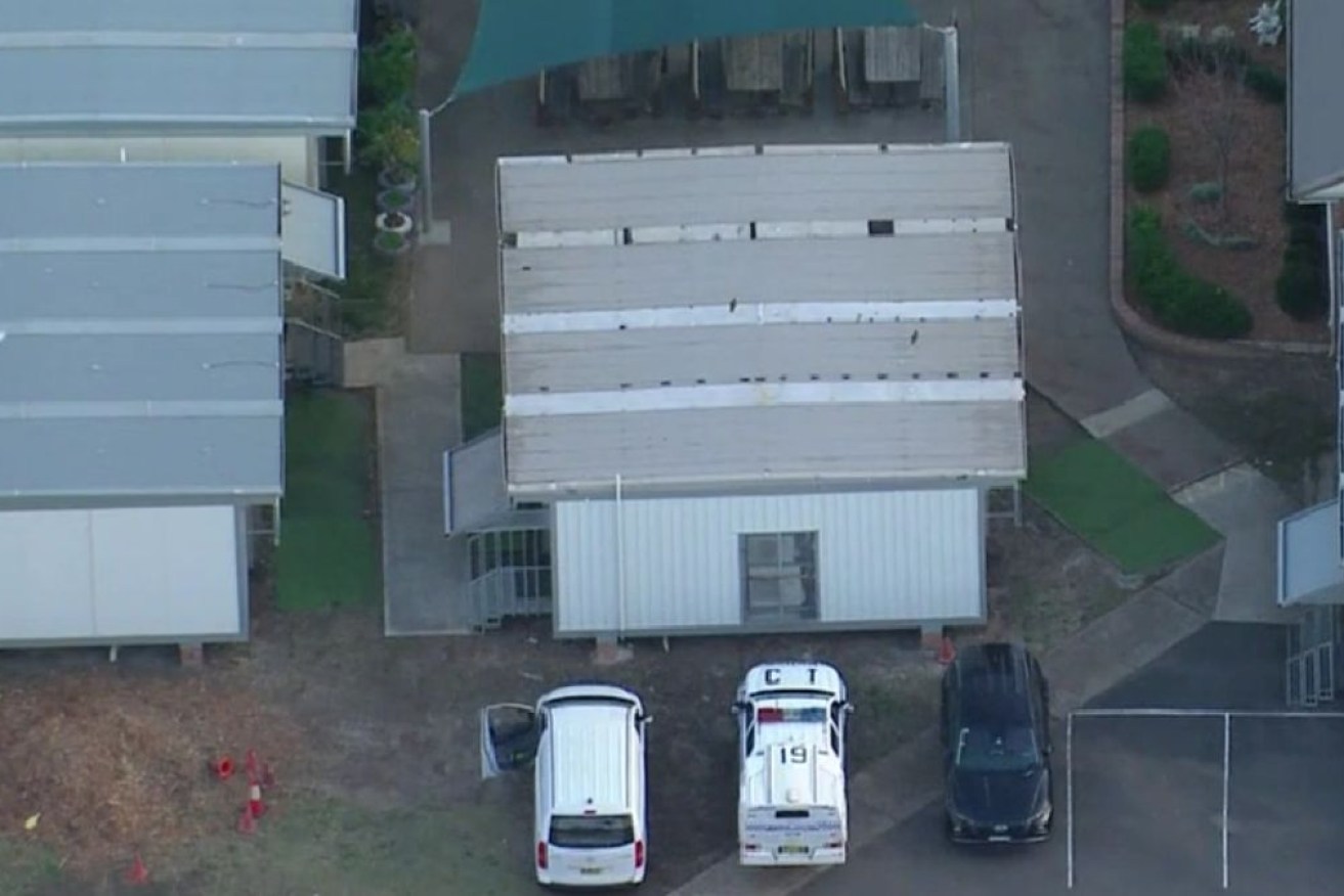 Police attend Macquarie Fields Public School in Sydney on Tuesday.