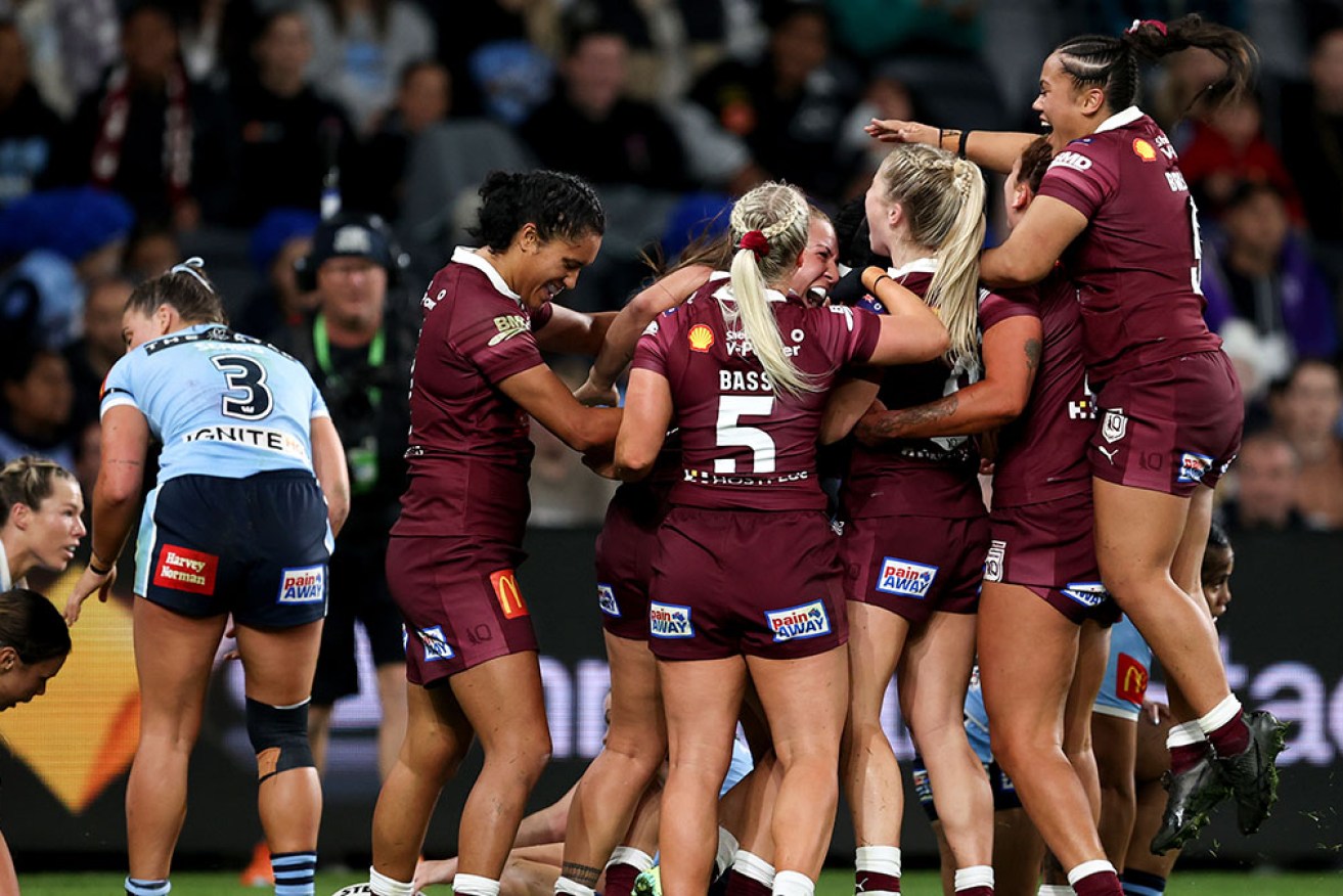 Maroons teammates celebrate Tazmin Gray's try on their way to victory in the Women's Origin opener.