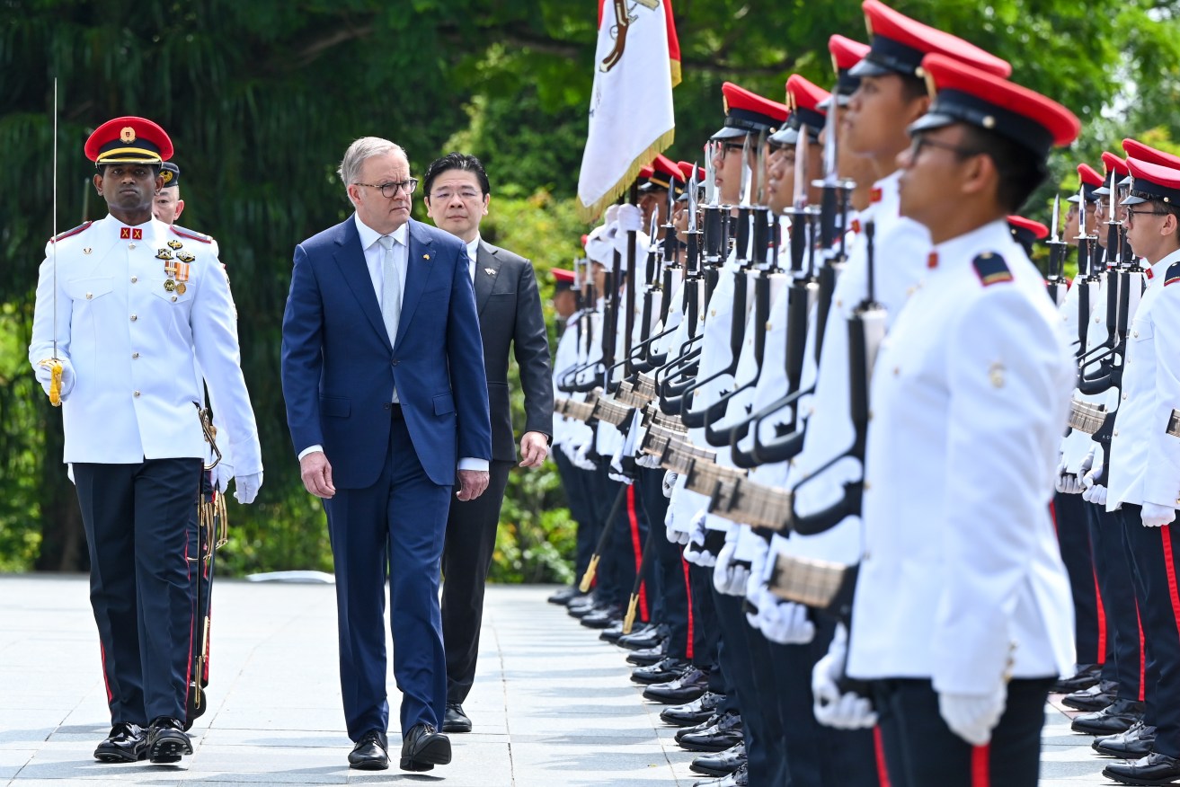 Anthony Albanese reviews honor guards with Singapore’s Acting Prime Minister Lawrence Wong.