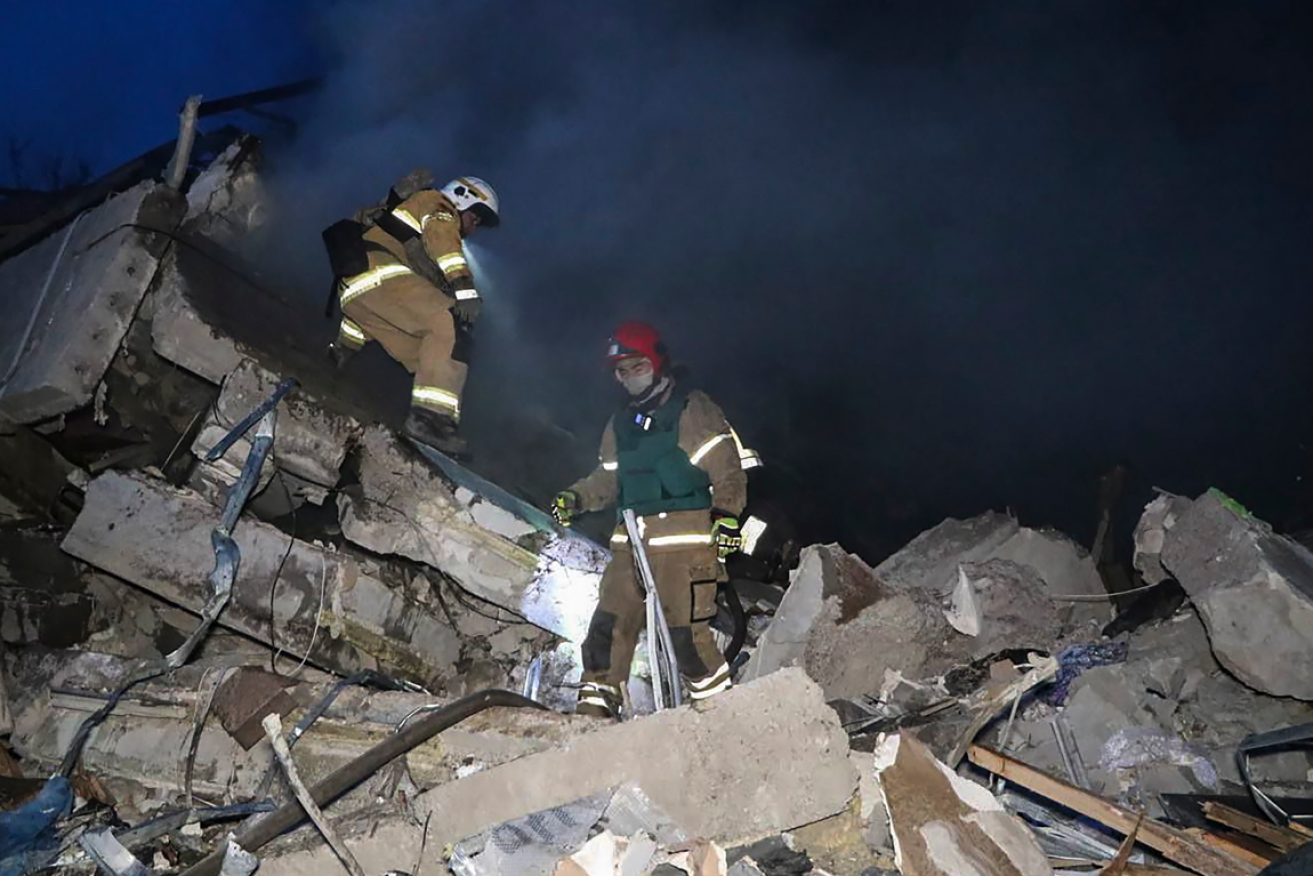 Rescuers hunt for survivors in what remains of the apartment complex after the Russian missile strike.