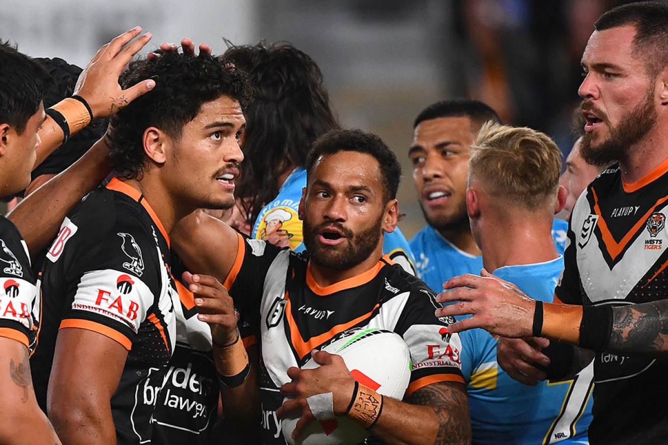 A broken jaw has sidelined Api Koroisau (centre) in Wests Tigers’ loss to Gold Coast on Thursday night. 