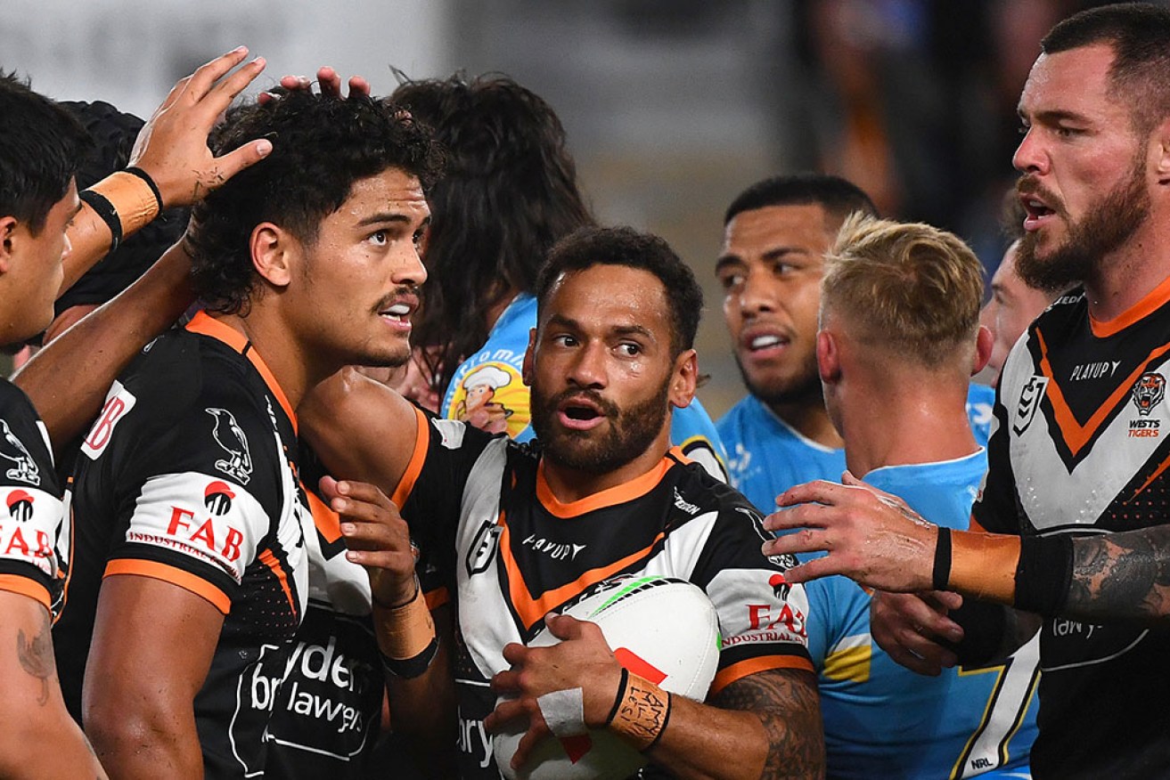 A broken jaw has sidelined Api Koroisau (centre) in Wests Tigers’ loss to Gold Coast on Thursday night.