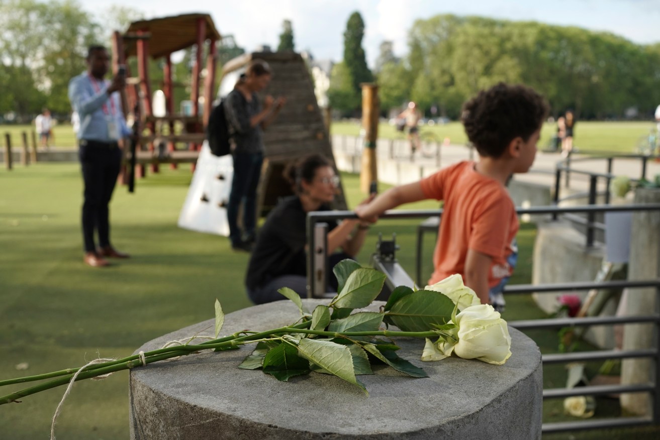 Roses lay at the playground after the horrific knife attack on toddlers in Annecy.