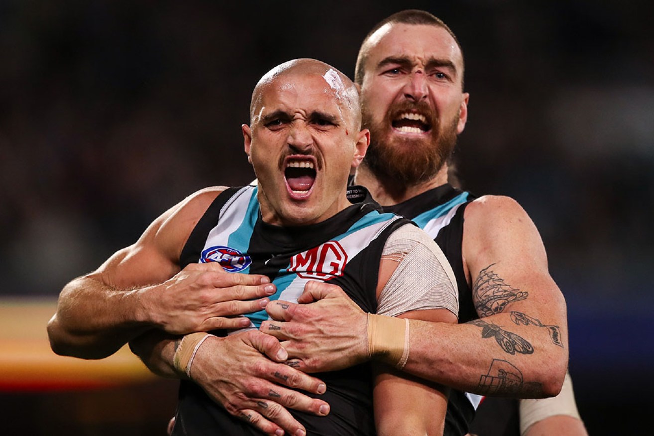 Port Adelaide's Sam Powell-Pepper and Charlie Dixon celebrate a goal in the win over Geelong.