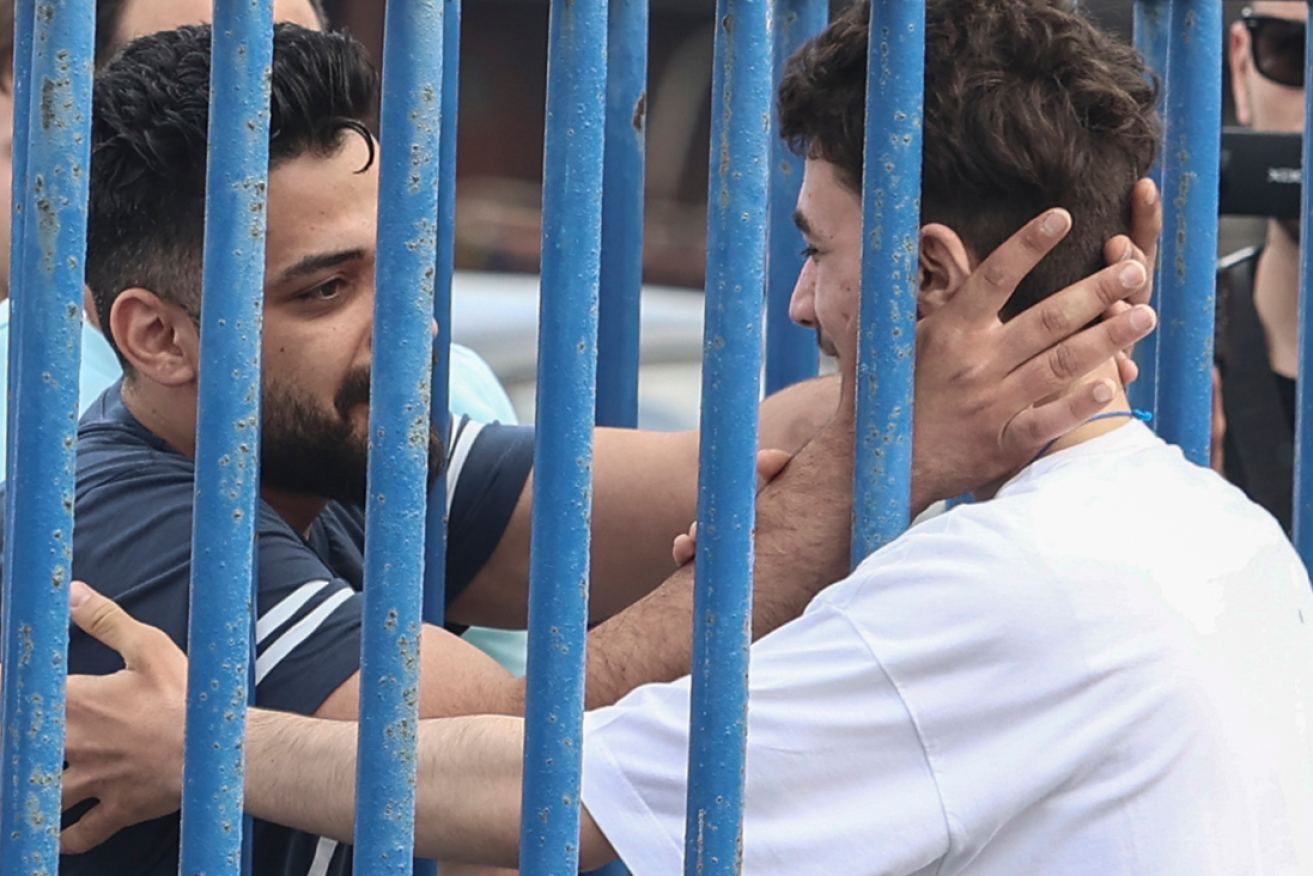 Brothers Fadi and Mohammad erupt in joy after finding each other amongst survivors of the horrific sinking.