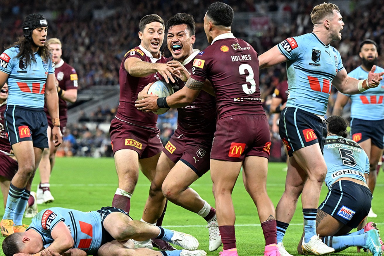 Queensland’s Jeremiah Nanai enjoyys his late try at Suncorp Stadium in Brisbane on Wednesday.