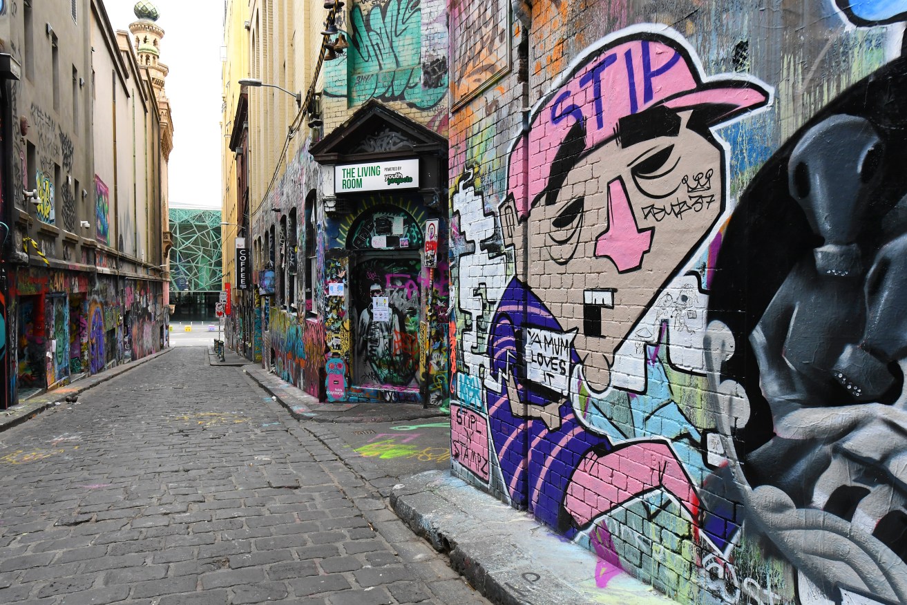 A garbage truck driver was pinned by his own truck while working in Melbourne's Hosier Lane.