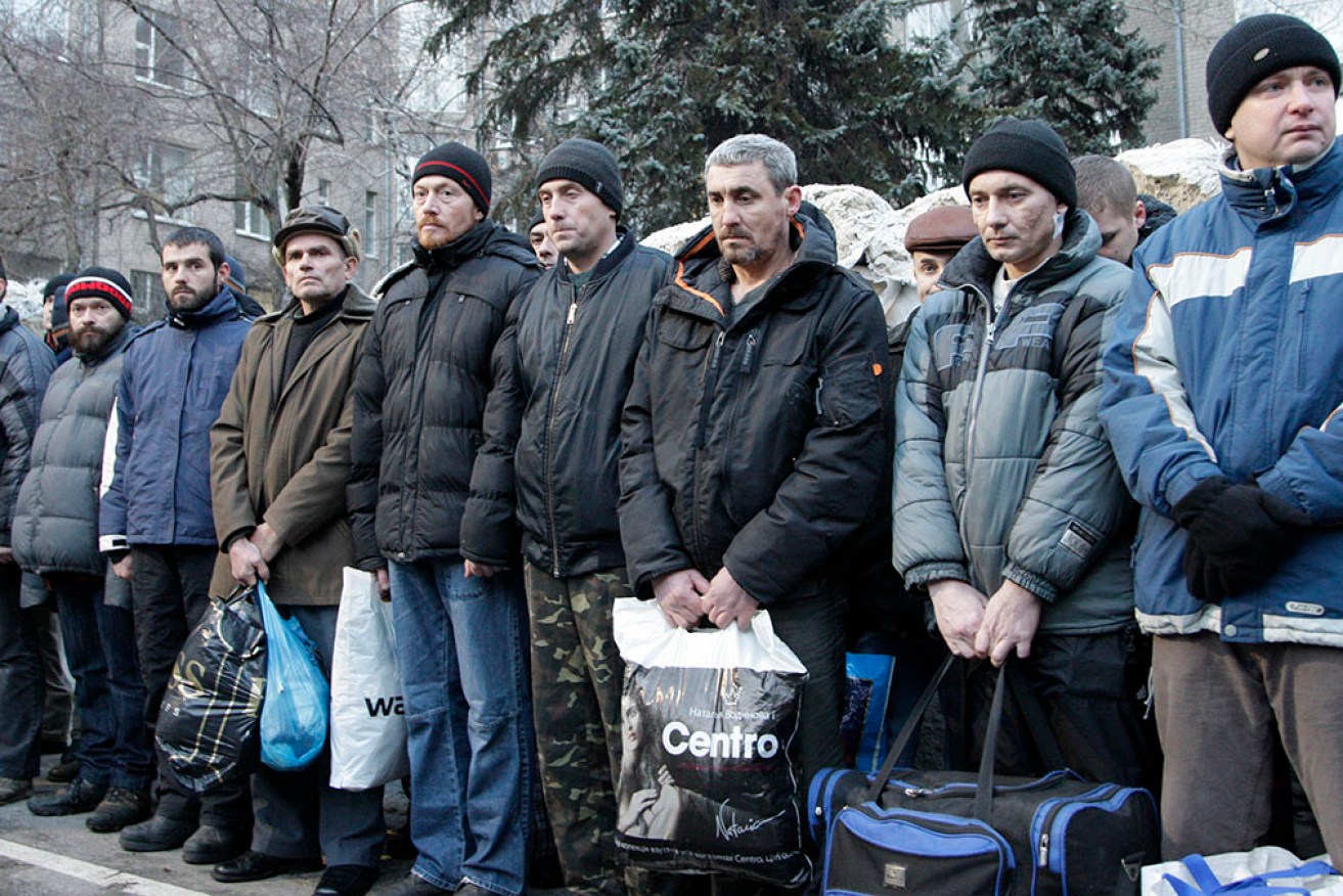 A UN report says Russia and Ukraine have both violated international law by detaining civilians.
