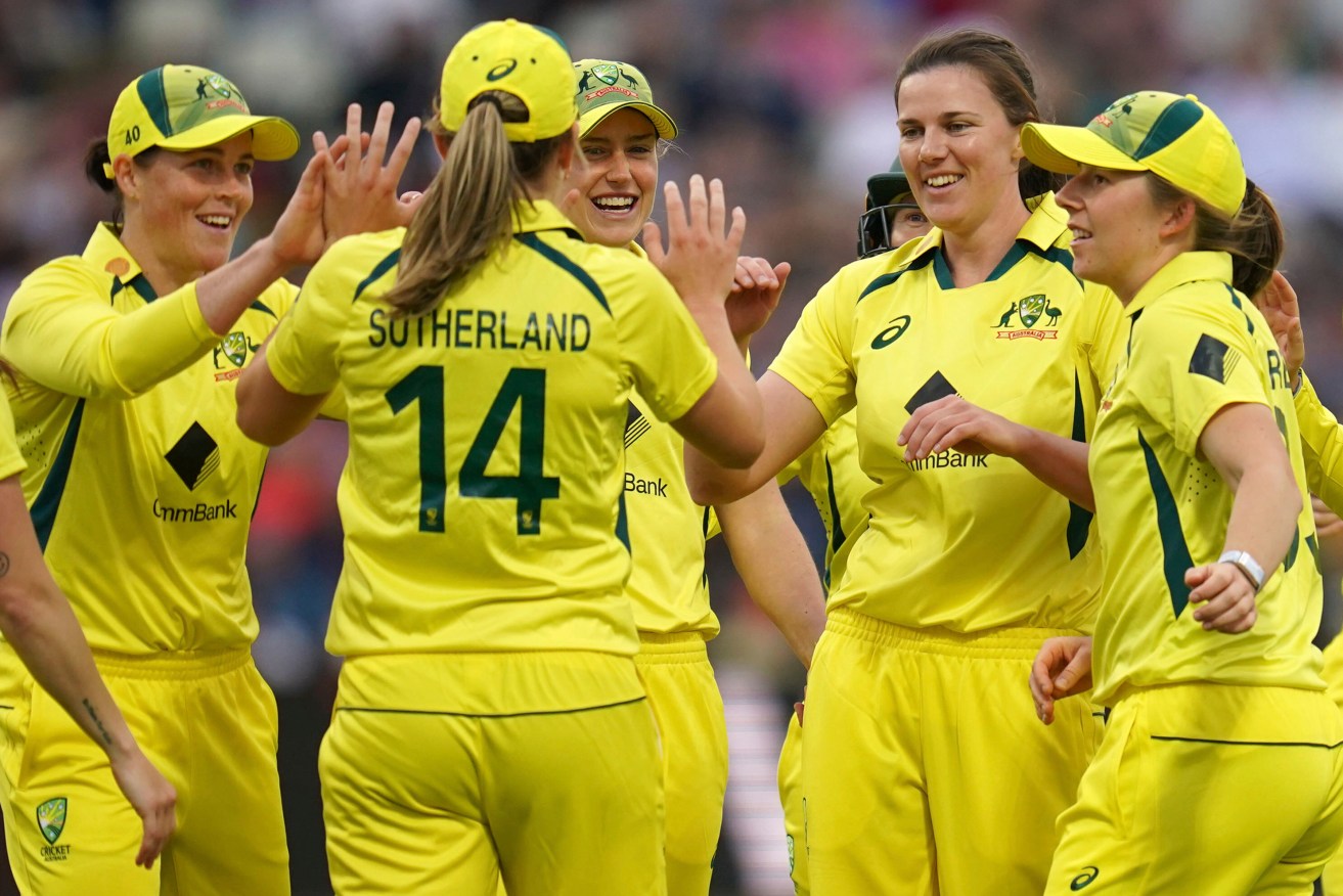 Australia's Tahlia McGrath (second right) leads the celebrations after dismissing Heather Knight.