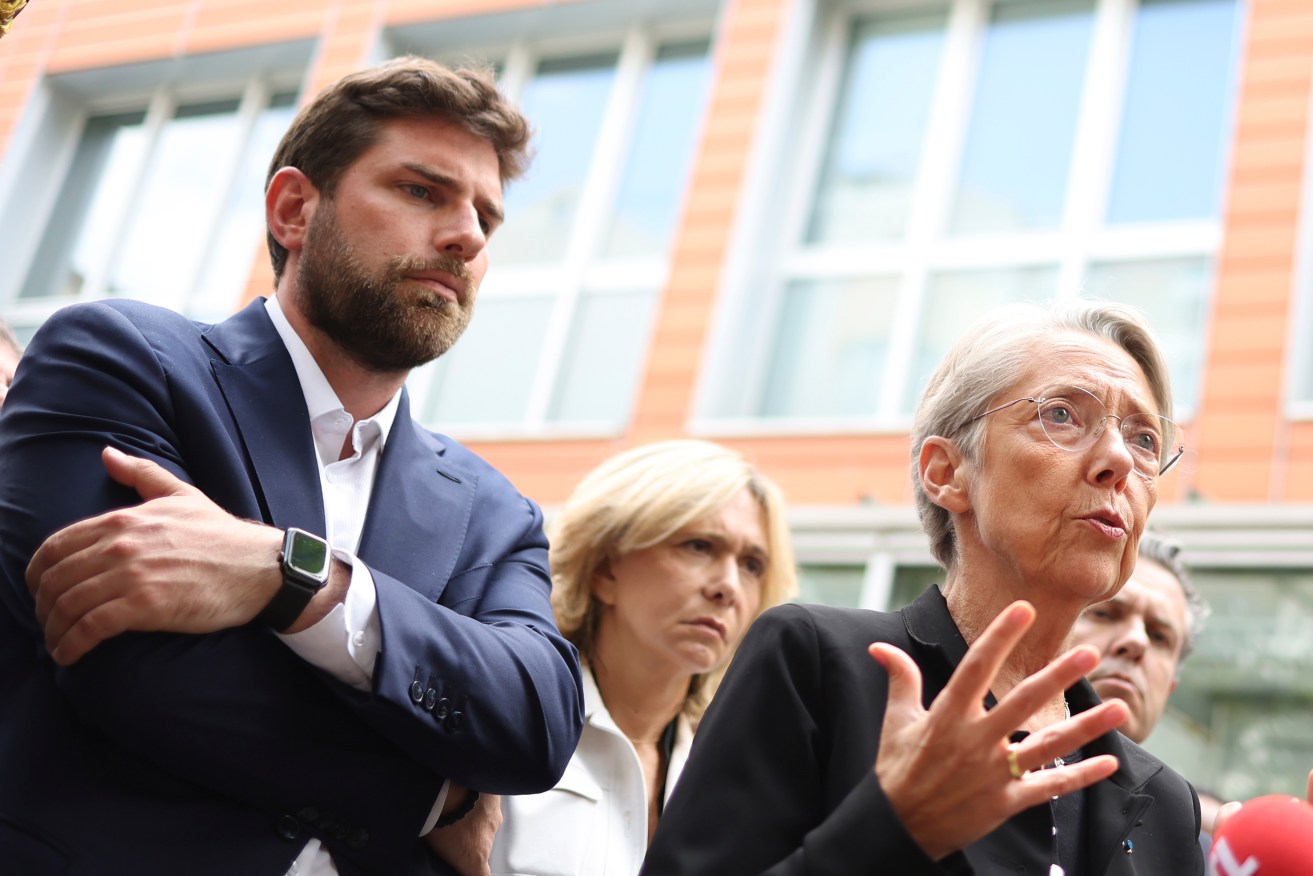 Vincent Jeanbrun, left, the Mayor of L'Hay-les-Roses, and French Prime Minister Elisabeth Borne after rioters rammed a vehicle into his house.