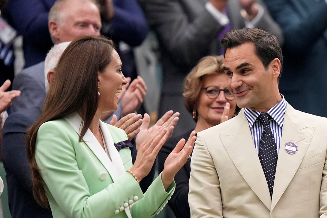 Roger Federer is applauded at Wimbledon's central court by the crowd and the Princess of Wales.