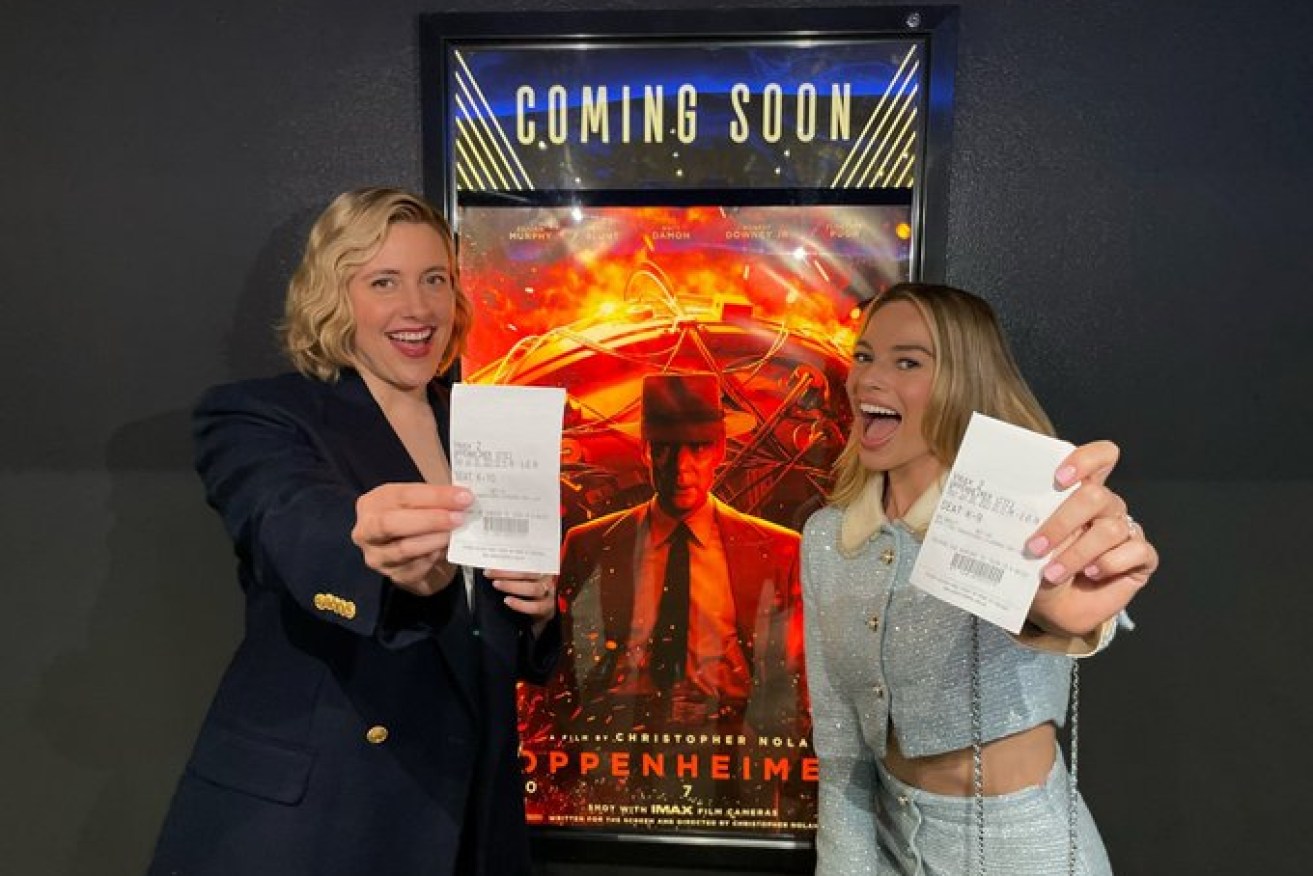 Barbie's director Greta Gerwig and lead actress Margot Robbie with tickets in hand to see Cillian Murphy in Oppenheimer.