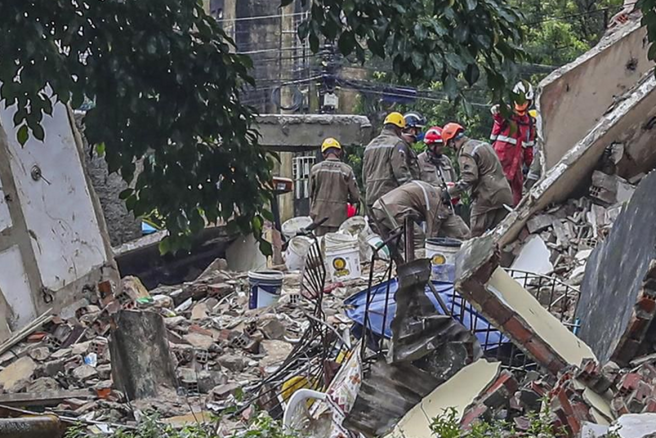 Rescuers pick through the rubble for survivors of the collapse.