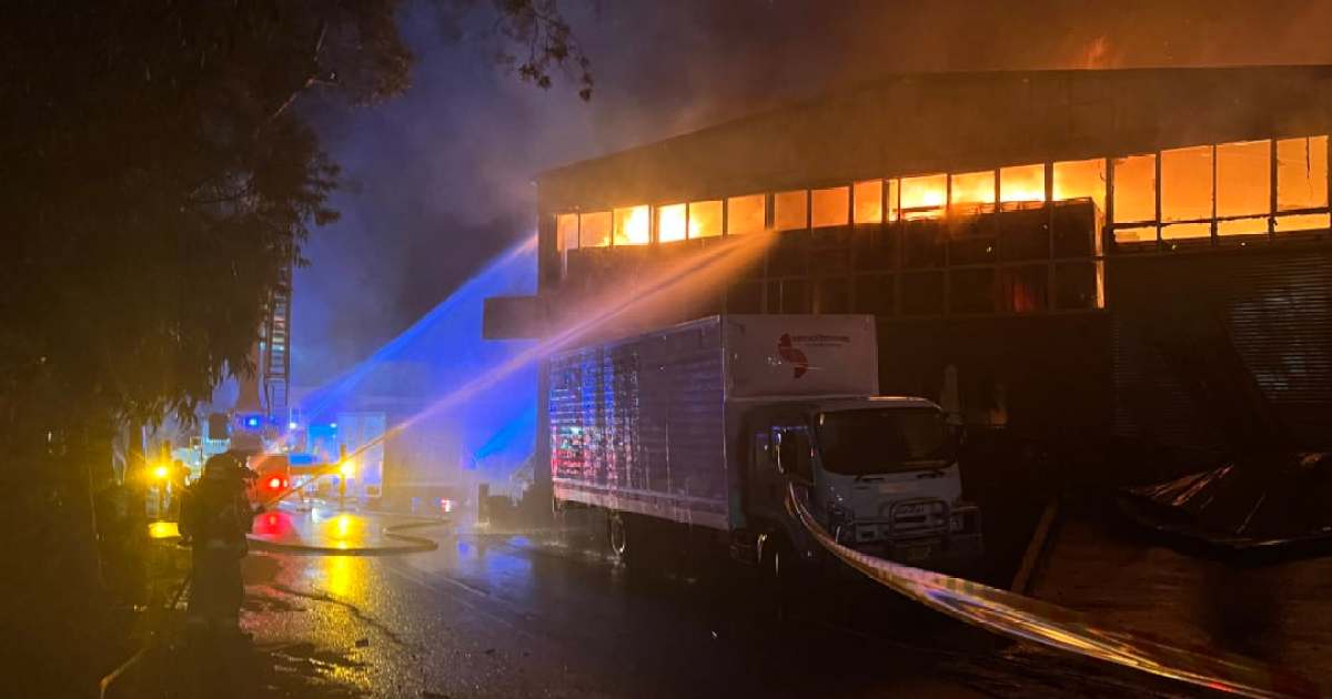 Smoke warning after firefighters battle Sydney industrial blaze