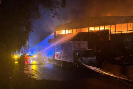 Smoke warning after firefighters battle Sydney industrial blaze