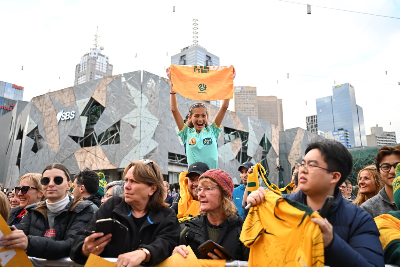 Fans greet the Matildas at Federation Square, Melbourne.
