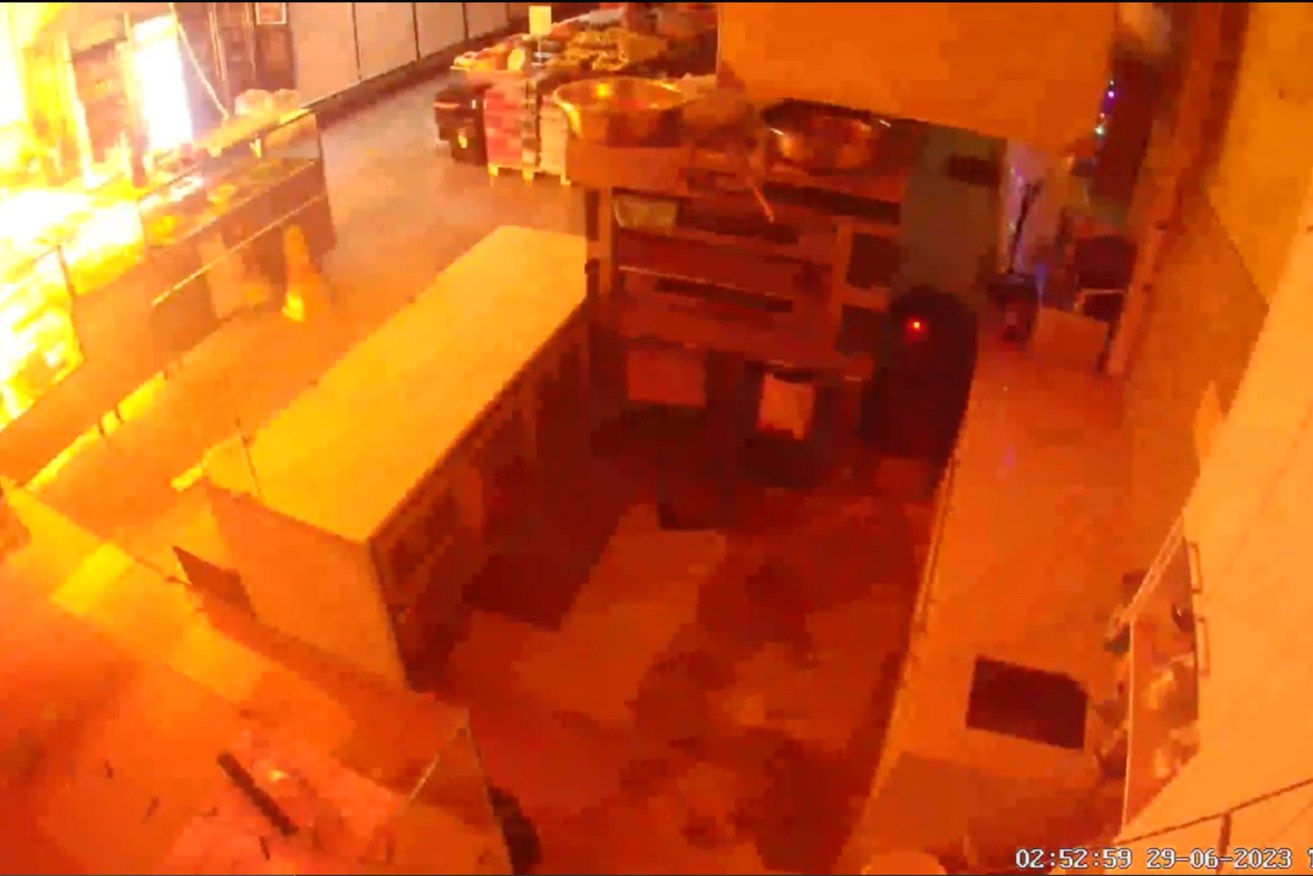 Fire rages during an arson attack on a business in Smith Street, Collingwood, on June 29.
