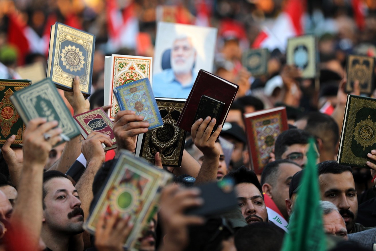 Hundreds of Iraqis have protested against actual and attempted attacks on the Koran in Denmark and Sweden.