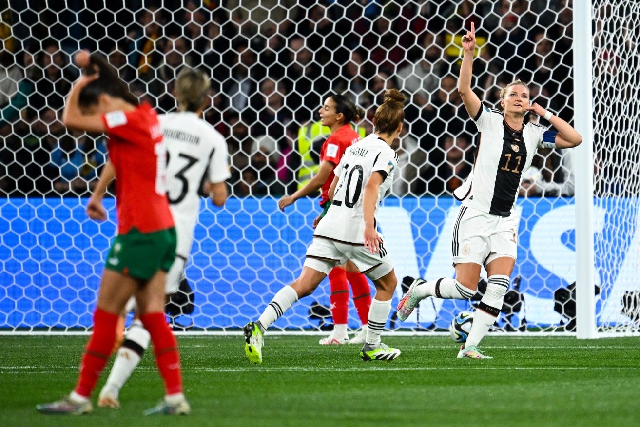 Alexandra Popp of Germany (right) celebrates after scoring a goal during the FIFA Women's World Cup soccer match between Germany and Morocco. 
