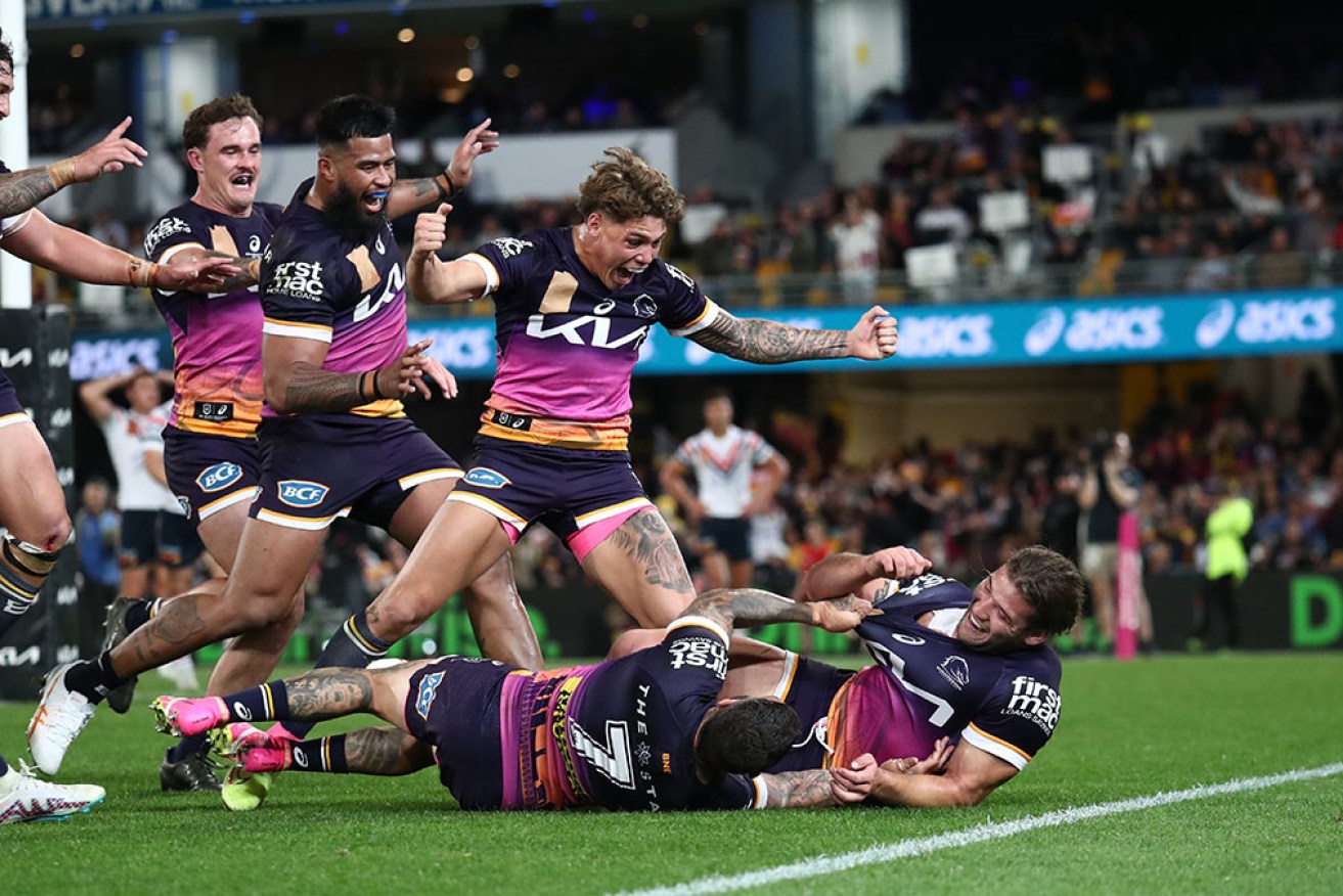 Brisbane's Pat Carrigan scores his career-first NRL try in a 32-10 win over the Roosters.