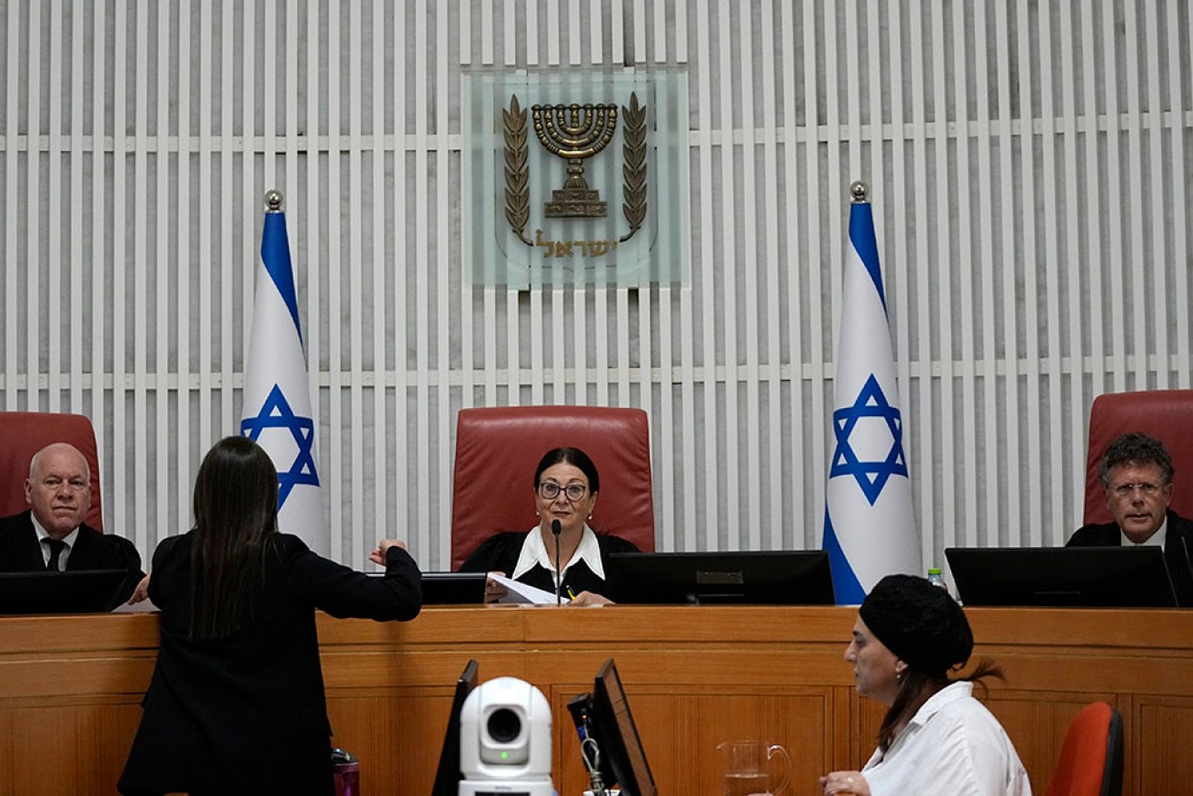 Three Supreme Court justices are hearing an appeal against Israel's contentious judicial overhaul. 