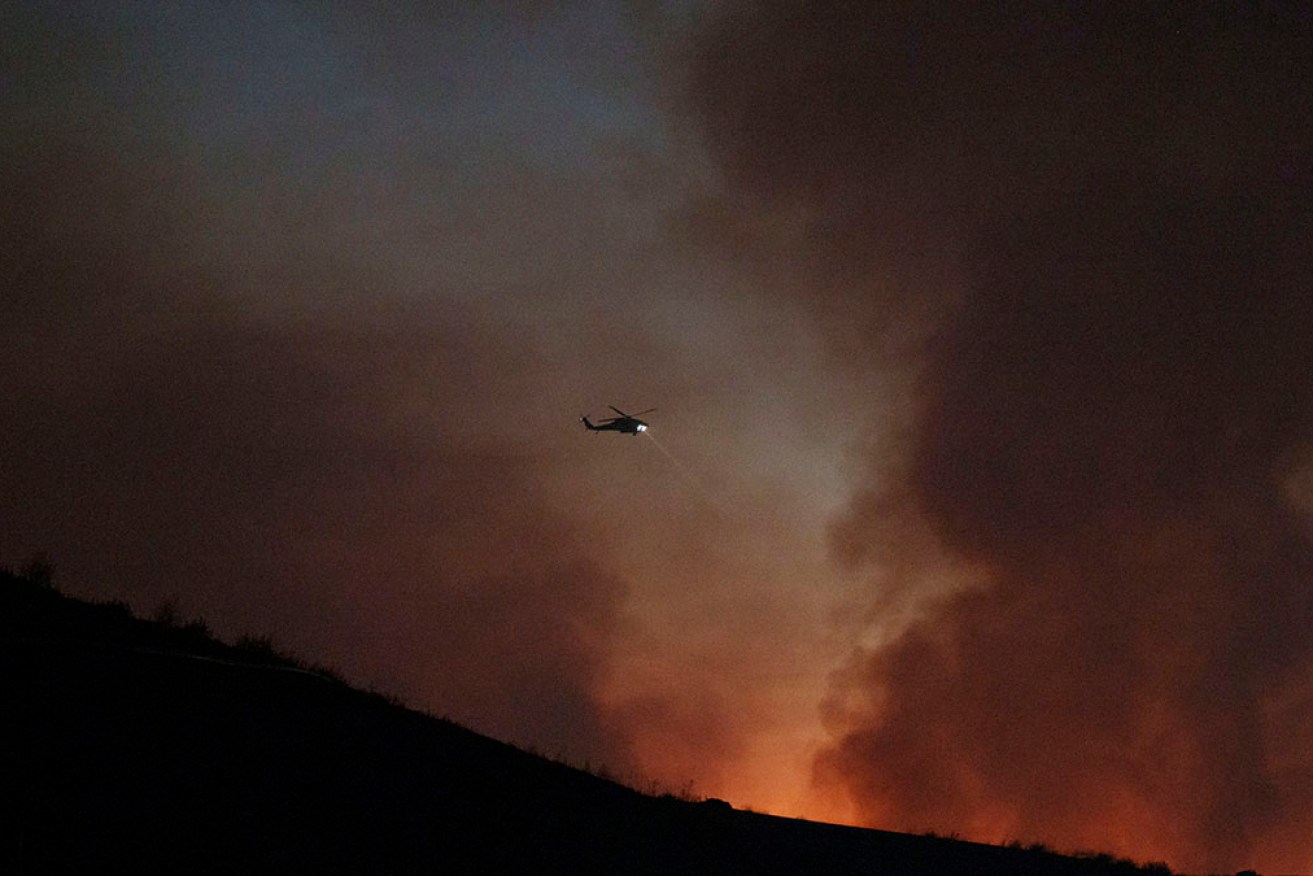 A fire chief, fire captain and pilot have been killed when two helicopters collided in California.