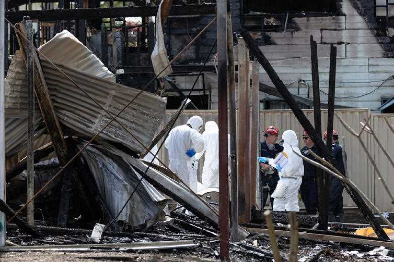 Investigators are yet to identify the cause of a fire that killed six people on a Queensland island.