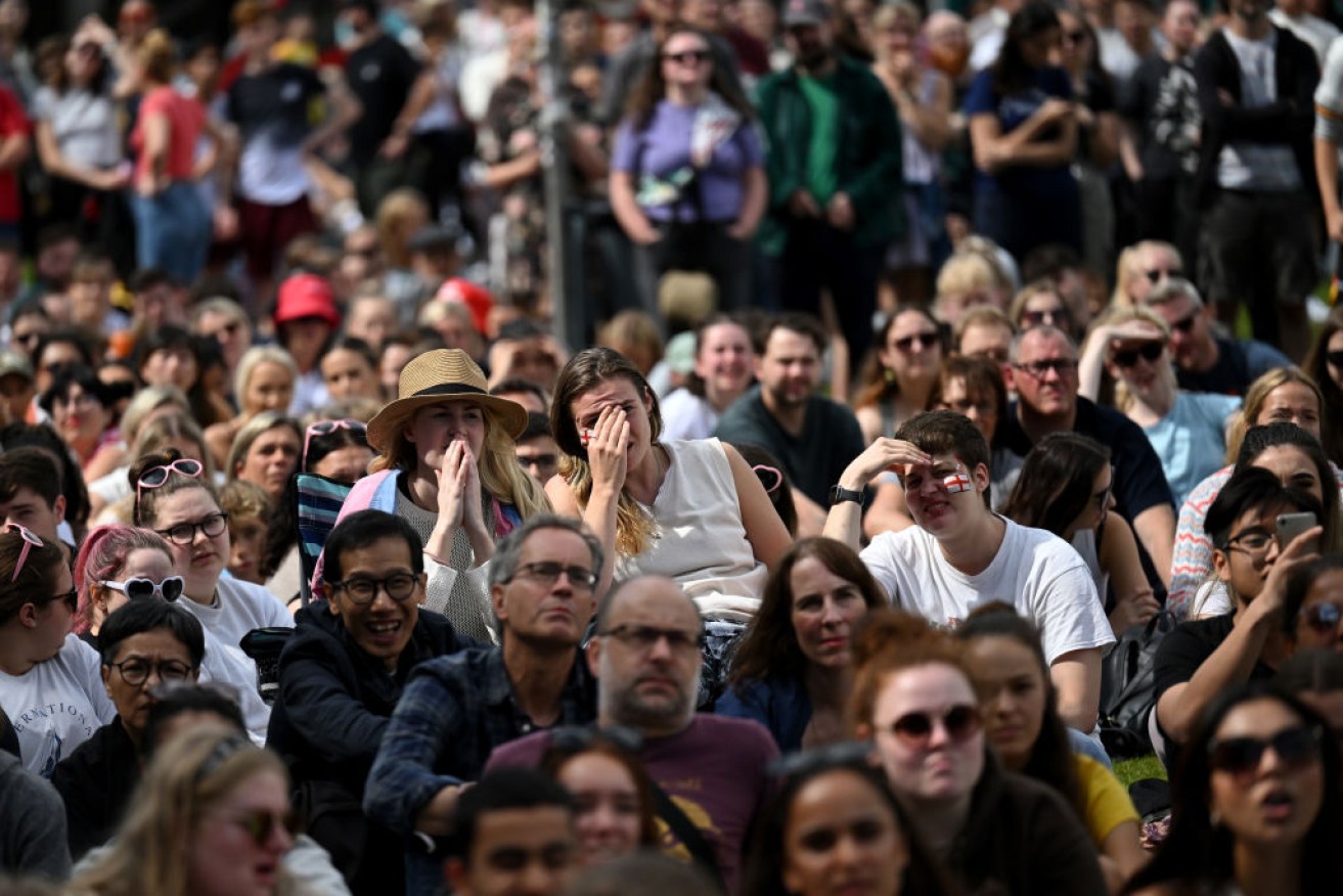 England fans react as they watch the FIFA Women's World Cup Final between England and Spain at Manchester Piccadilly Gardens, England.  