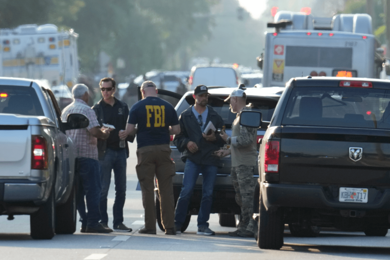 Another day in the US: Police converge on the scene of an August slaughter in Jacksonville, Florida.