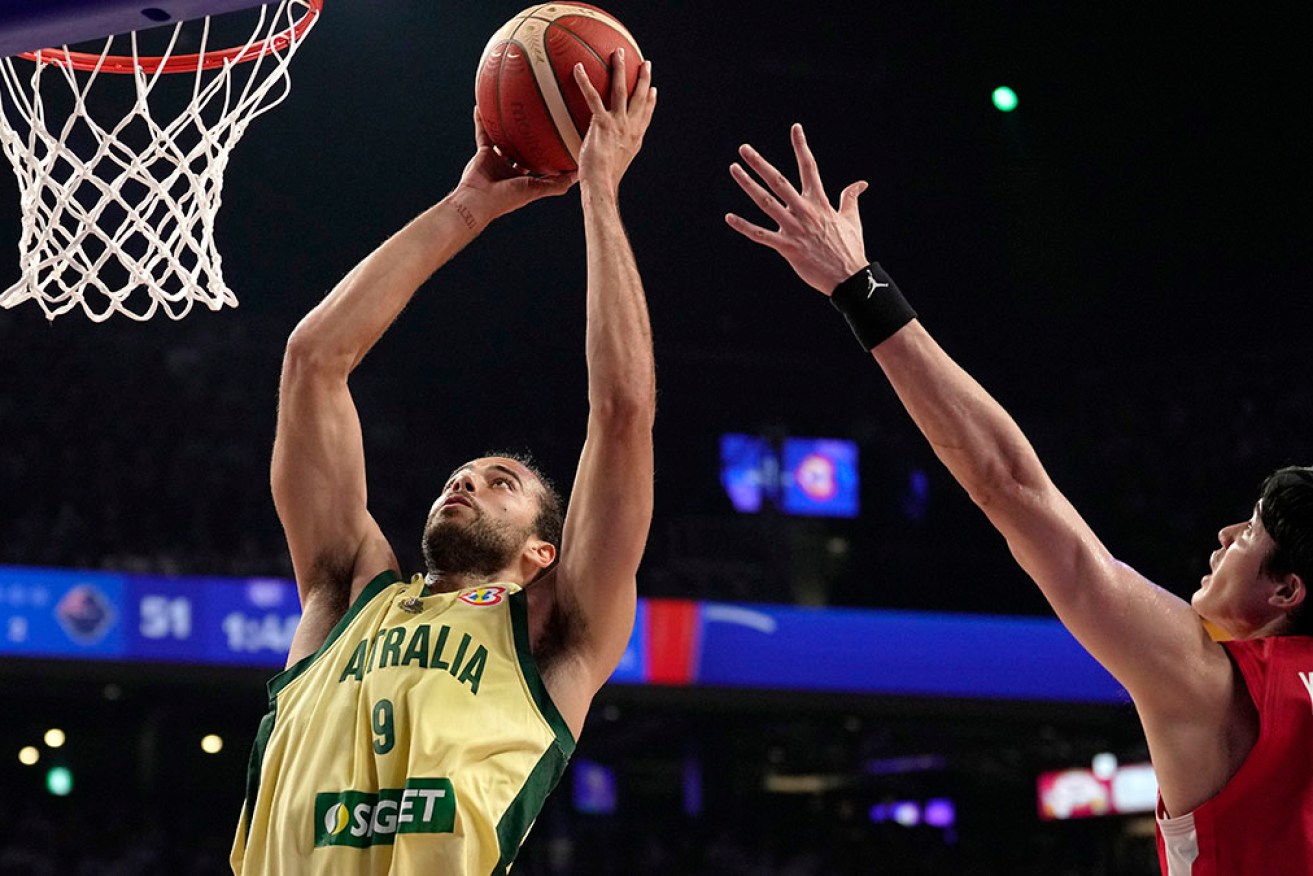 Xavier Cooks drives to the basket for Australia in the 109-89 World Cup win over Japan.