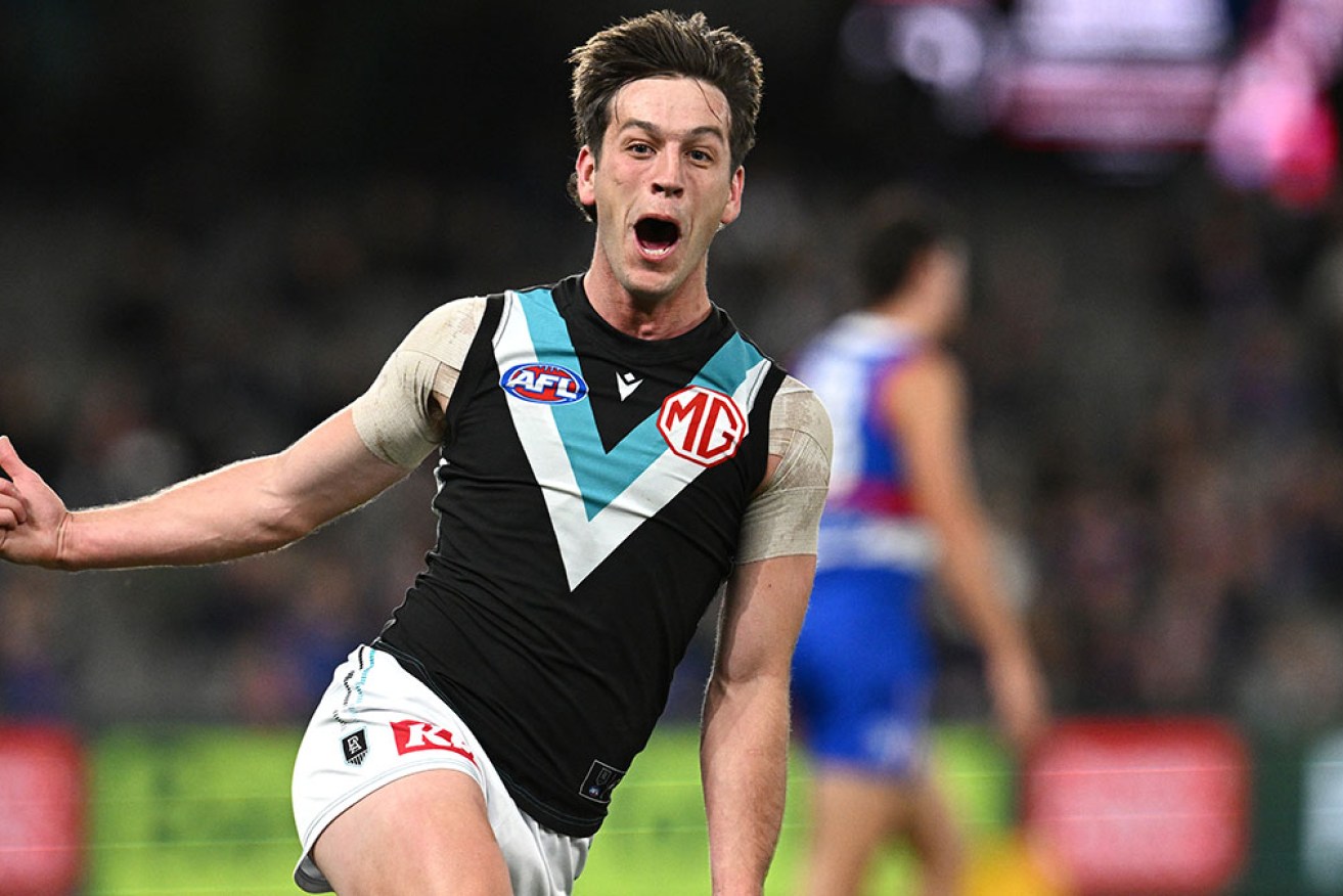Port Adelaide's Zak Butters has taken out the AFL coaches' champion-player award for 2023. 