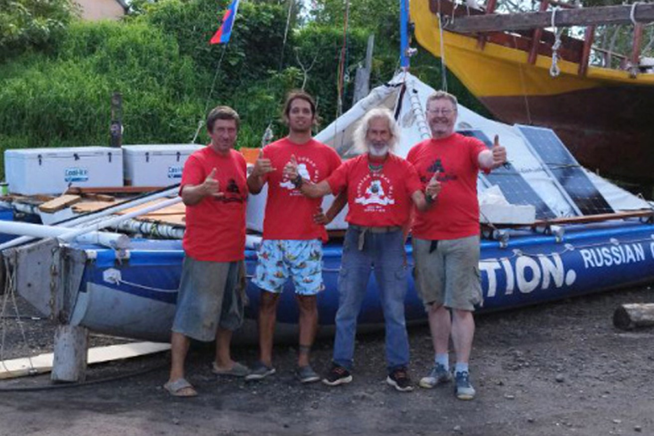The Tion's Russian crew and an Argentinian friend on Easter Island with their "new" catamaran.