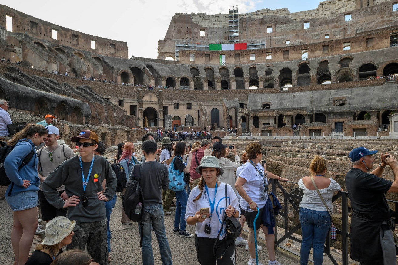 Tourists inside the Colosseum, which receives six million visitors a year.