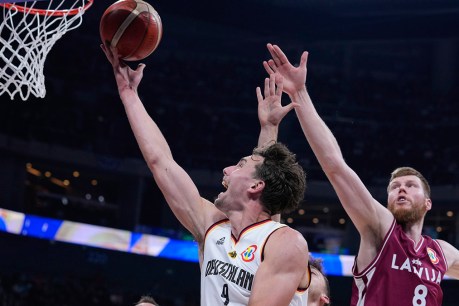 Germany holds off Latvia to reach World Cup semi