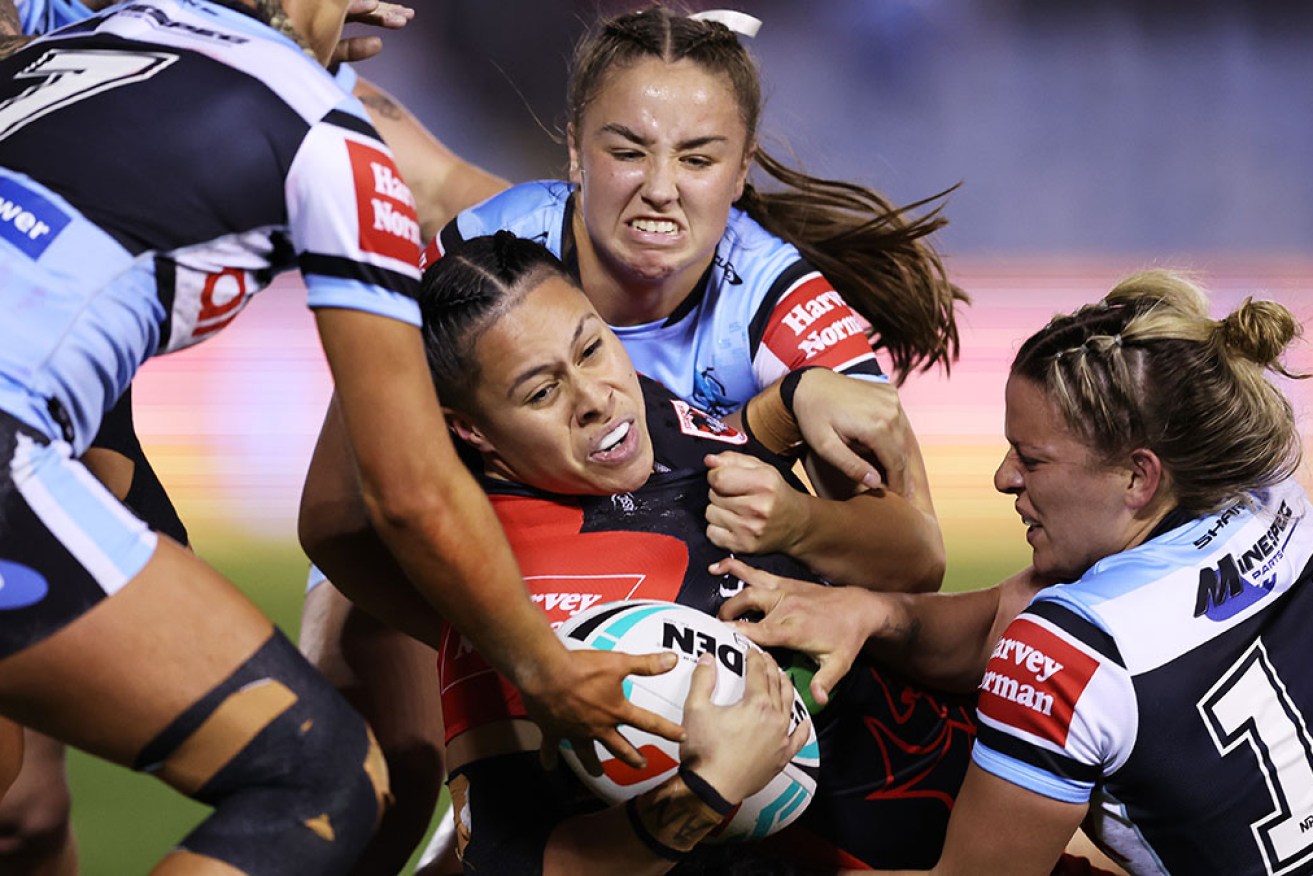 Cronulla’s defence wraps up St George-Illawarra’s Angelina Teakaraanga-Katoa on Thursday night. 