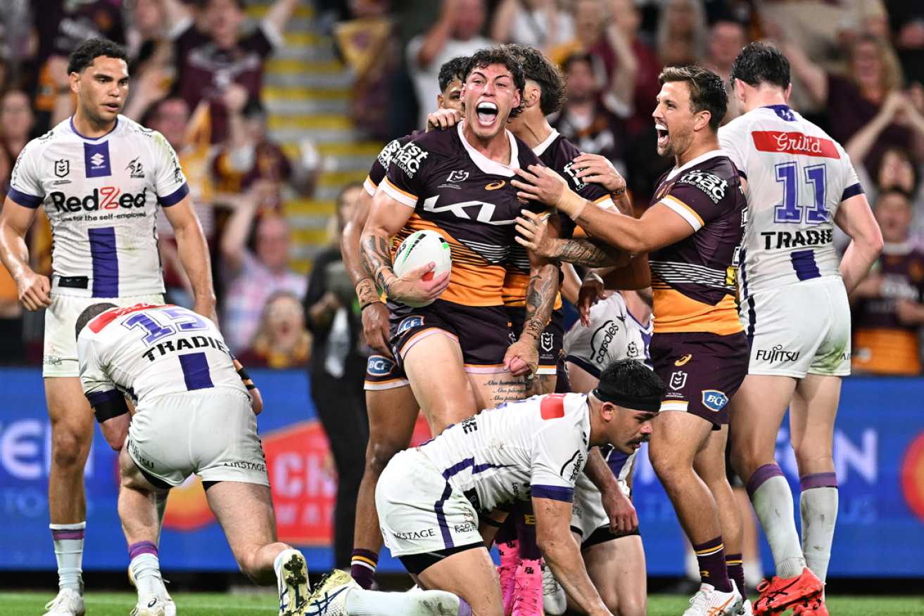 The Broncos' Jordan Riki erupts with delight after crossing the try line.