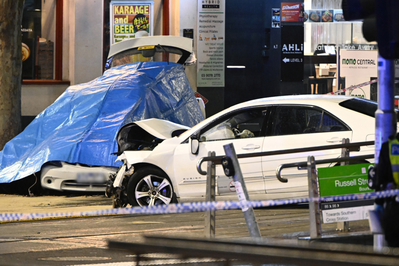 The suspect's car where it came to rest, still meshed with the vehicle in which the 76-year-old victim died.