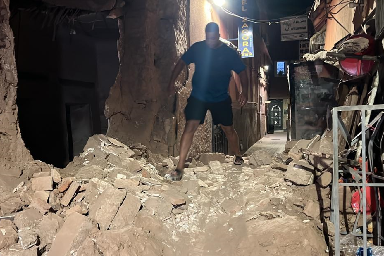 A man picks his way through the post-quake rubble in devastated Rabat.
