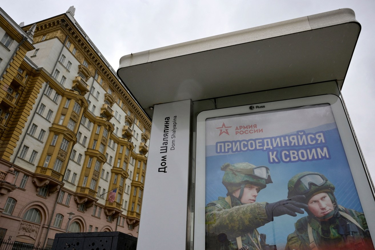 An advertising screen promoting contract military service in the Russian army sits on a bus stop near the US embassy in Moscow on May 31, 2023.