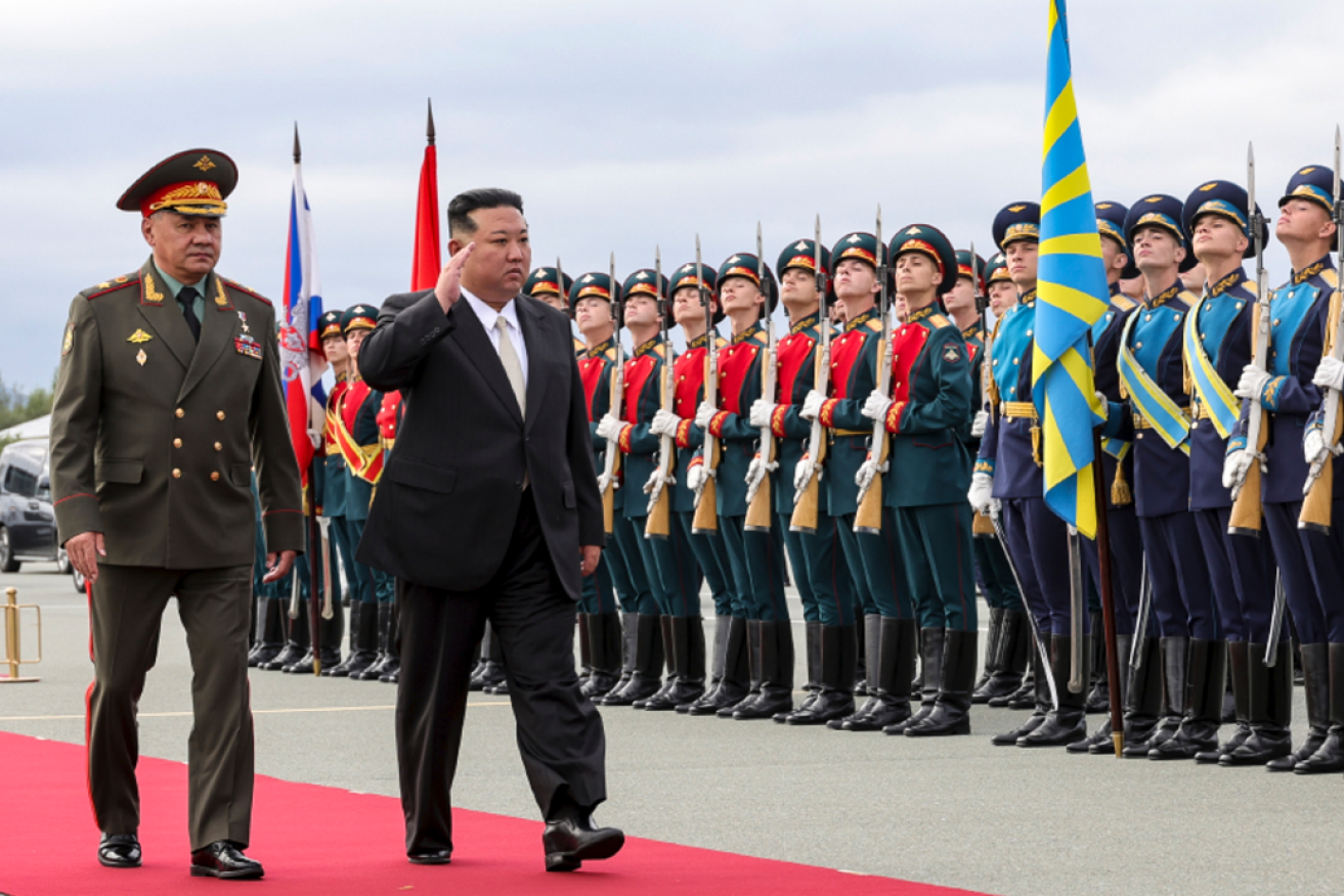 Kim jung-un is welcomed as an honoured guest by Russian troops and the country's defence minister.