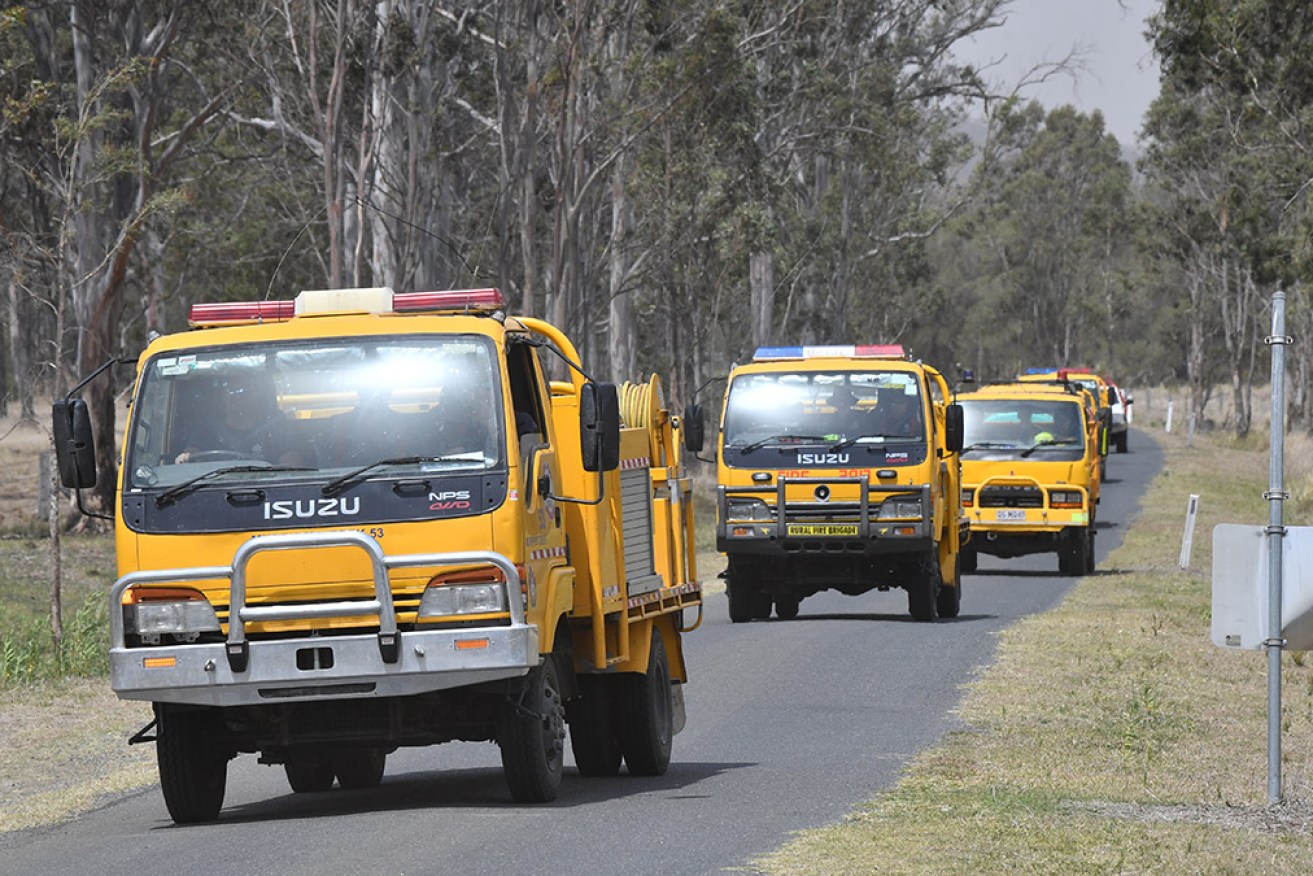 Queensland firefighters continue to battle a blaze that has burned through more than 3000 hectares.