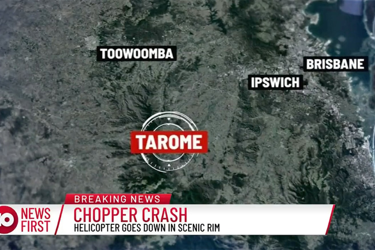 A helicopter crashed while collecting water to fight a bushfire near Scenic Rim in Queensland.
