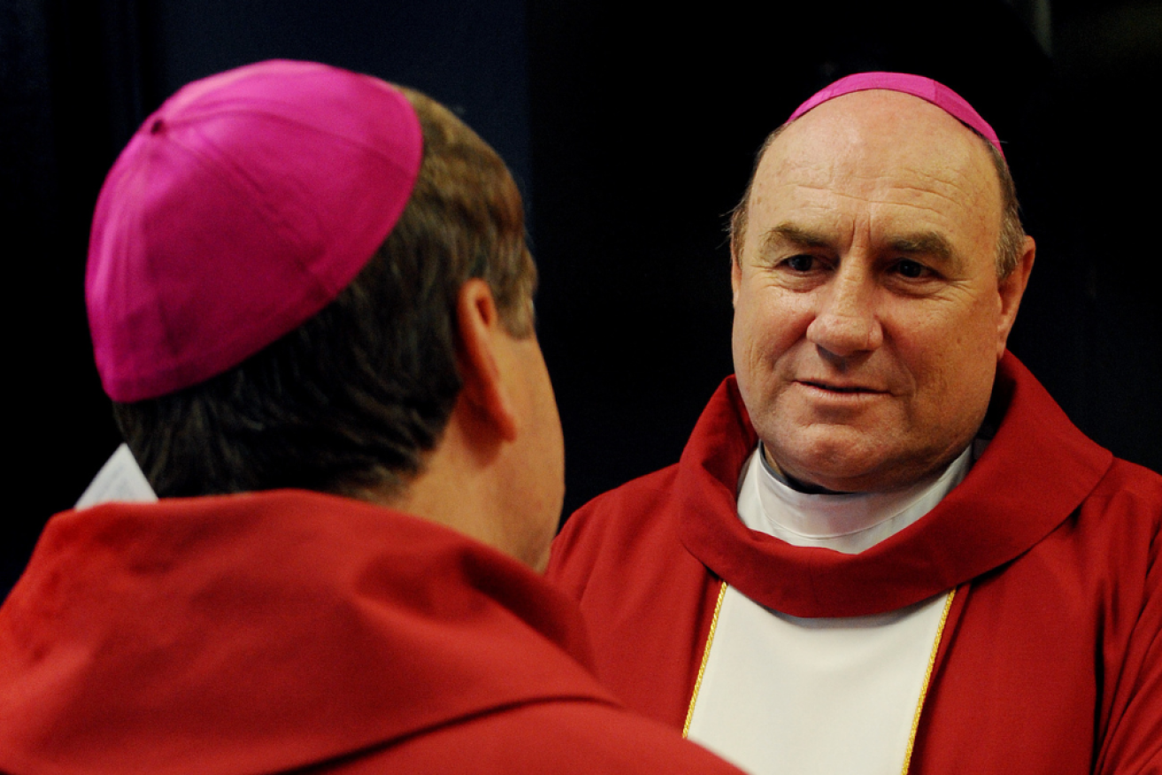 Former bishop Christopher Saunders (right) has been charged over historical child sexual abuse.