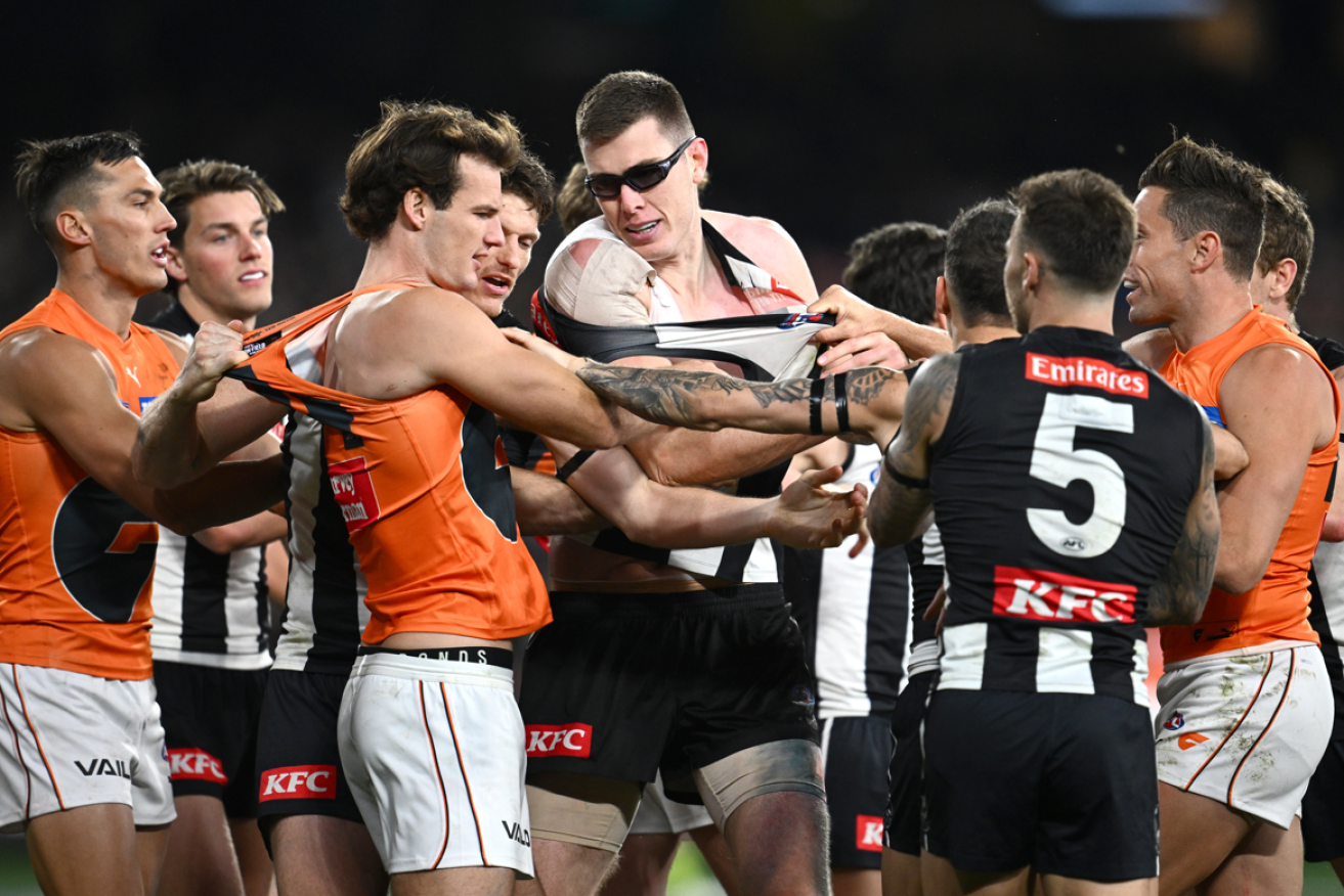 Tempers flare and jumpers get torn during of the knife-edge moments before Collingwood's one-point triumph.
