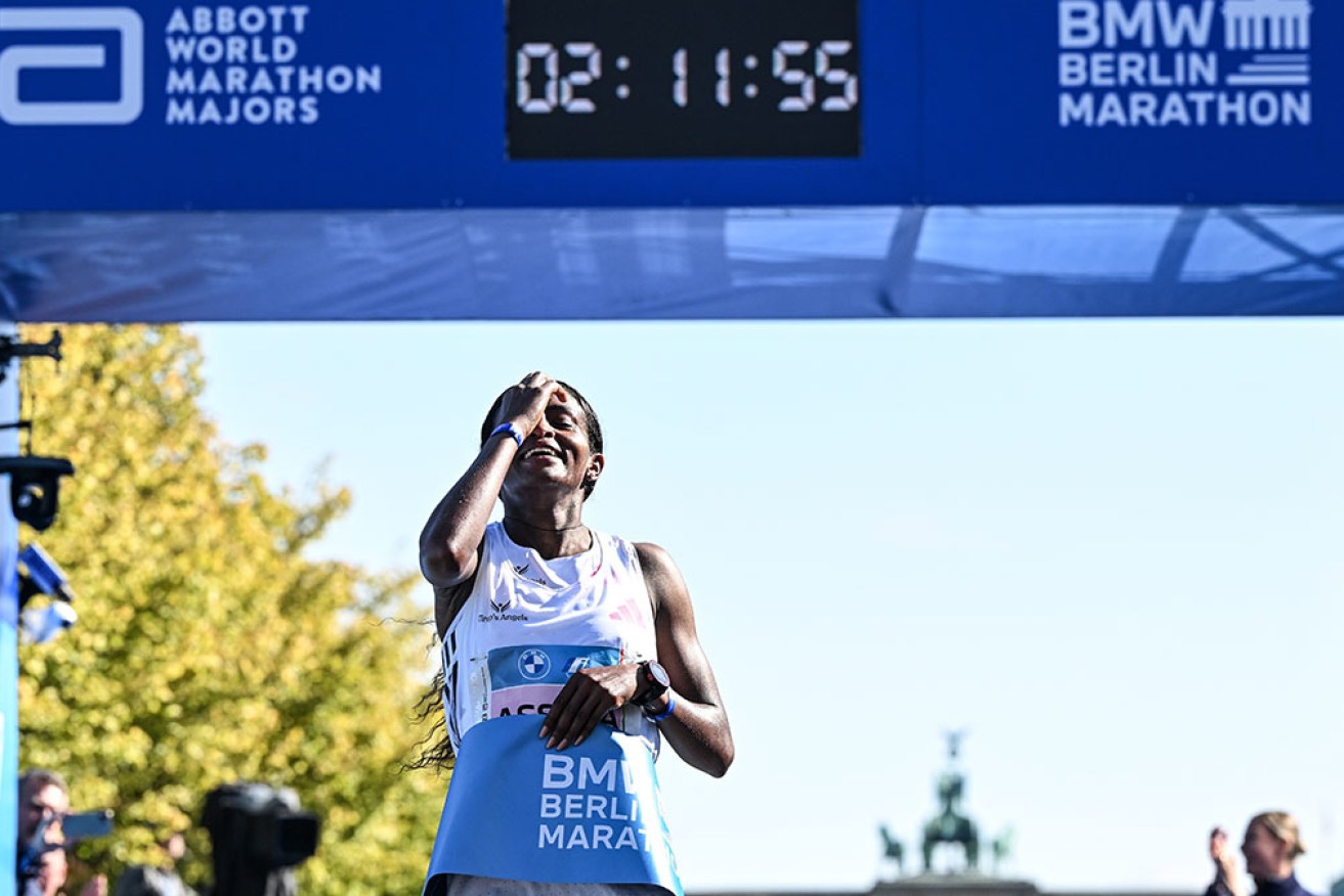 Tigst Assefa has bettered the women's marathon world record to two hours 11 minutes and 53 seconds.